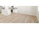 Open kitchen with stainless steel appliances and hardwood flooring throughout at 383 Remuda Rd, Berthoud, CO 80513