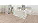 Modern kitchen featuring stainless steel appliances, island, and neutral colored cabinets at 383 Remuda Rd, Berthoud, CO 80513