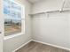 Empty walk-in closet with shelves and a window for natural light at 383 Remuda Rd, Berthoud, CO 80513