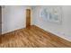 Bright bedroom boasts hardwood floors, a shuttered window and a wood door at 4365 S Alton Way, Greenwood Village, CO 80111