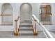 Close-up of the staircase with white railings and wooden accents at 4365 S Alton Way, Greenwood Village, CO 80111