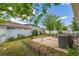 Fenced backyard, concrete patio, and green space at 5403 Odessa St, Denver, CO 80249