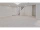 Finished basement offering a spacious living area with soft carpeting and stairway access at 5403 Odessa St, Denver, CO 80249
