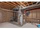 Unfinished basement with exposed ceiling and mechanicals, offering potential for customization at 5403 Odessa St, Denver, CO 80249