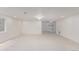 Large finished basement with recessed lights, chandelier, neutral carpet and walk-out access at 5403 Odessa St, Denver, CO 80249