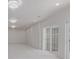 Bright basement featuring an elegant chandelier and sliding glass doors at 5403 Odessa St, Denver, CO 80249
