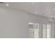 Bright basement featuring an elegant chandelier and sliding glass doors at 5403 Odessa St, Denver, CO 80249