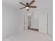 Bedroom with ceiling fan and open closet doors at 5403 Odessa St, Denver, CO 80249