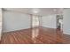 Spacious living room featuring gleaming hardwood floors and a modern chandelier at 5403 Odessa St, Denver, CO 80249