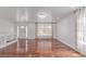 Spacious living room featuring gleaming hardwood floors, and ample natural light at 5403 Odessa St, Denver, CO 80249