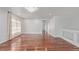 Spacious living room featuring gleaming hardwood floors and a modern chandelier at 5403 Odessa St, Denver, CO 80249