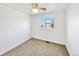 Bedroom featuring neutral carpet, ceiling fan and a bright window with a view at 12203 Wolff Dr, Broomfield, CO 80020