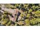 Aerial view of the property showcasing its secluded location surrounded by lush trees and natural landscaping at 25531 Mosier Cir, Conifer, CO 80433