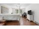 Spacious bedroom with a four poster bed, wood floors, and view to the outdoors at 25531 Mosier Cir, Conifer, CO 80433