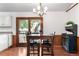 Dining room with wood table, chairs and view to the outdoors at 25531 Mosier Cir, Conifer, CO 80433