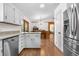 Bright kitchen with white cabinets, stainless steel appliances, and ample counter space at 25531 Mosier Cir, Conifer, CO 80433