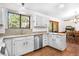 Bright kitchen with stainless steel appliances, and views of the outdoors at 25531 Mosier Cir, Conifer, CO 80433