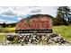 Welcome to Conifer sign with scenic mountain backdrop, courtesy of the Conifer Area Chamber of Commerce at 25531 Mosier Cir, Conifer, CO 80433