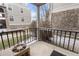 Outdoor patio offers metal railing, concrete surface, and views of the building exterior at 5403 W 76Th Ave # 607, Arvada, CO 80003