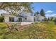 Spacious backyard with flagstone patio, bordered flower beds and expansive lawn at 6668 Walker Ct, Niwot, CO 80503
