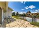 Backyard patio with a bistro set and flagstone pavers overlooking the private tennis court at 6668 Walker Ct, Niwot, CO 80503