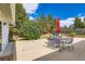 Outdoor patio featuring patio seating and a built-in barbeque grill, surrounded by mature shade trees at 6668 Walker Ct, Niwot, CO 80503