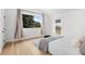 Well-lit bedroom with hardwood floors, a window and a comfortable bed at 6668 Walker Ct, Niwot, CO 80503