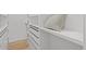Walk-in closet with custom shelving and drawers for ample storage at 6668 Walker Ct, Niwot, CO 80503