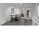 Dining area features a round table and seating for four, next to sliding doors to a large living area at 6668 Walker Ct, Niwot, CO 80503