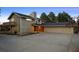 Charming exterior view of a home boasting a spacious driveway and a three-car garage at 6668 Walker Ct, Niwot, CO 80503