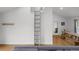 Bright living room with a decorative ladder feature, wooden floors, and open layout at 6668 Walker Ct, Niwot, CO 80503
