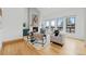 Bright living room with fireplace, large windows, hardwood floors, and stylish furniture at 6668 Walker Ct, Niwot, CO 80503