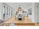 Spacious open-concept living and dining area with large windows and modern lighting at 6668 Walker Ct, Niwot, CO 80503