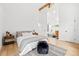 Bedroom with white walls, hardwood floors, and modern decor at 6668 Walker Ct, Niwot, CO 80503