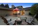 Outdoor entertaining area with a fire pit and a patio with dining area at 6668 Walker Ct, Niwot, CO 80503