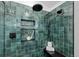 Modern shower featuring dual shower heads and unique green tile at 6668 Walker Ct, Niwot, CO 80503