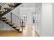 Modern staircase featuring hardwood steps and a sleek railing, leading to upper levels at 6668 Walker Ct, Niwot, CO 80503