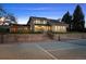 Exterior view of a charming home featuring a private tennis court, perfect for recreation and fitness at 6668 Walker Ct, Niwot, CO 80503