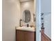 Charming half bath with pedestal sink, decorative mirror, and stylish fixtures at 4723 Crestone Peak St, Brighton, CO 80601