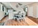 Charming dining area featuring a cozy breakfast nook and hardwood floors with easy access to the living room at 4723 Crestone Peak St, Brighton, CO 80601