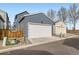 Two car garage showcasing the home's exterior, featuring a clean and modern design at 4723 Crestone Peak St, Brighton, CO 80601