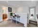 Bright hallway with a desk area, leading to bathroom and bedroom; cozy and functional design at 4723 Crestone Peak St, Brighton, CO 80601