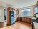 Bright kitchen features wooden cabinets, stainless steel appliances, and a large window at 4723 Crestone Peak St, Brighton, CO 80601