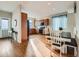 Bright, open-concept kitchen with a dining area, modern appliances, and wood cabinets at 4723 Crestone Peak St, Brighton, CO 80601