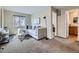 Comfortable living room featuring neutral tones and a cozy seating area with a large window at 4723 Crestone Peak St, Brighton, CO 80601