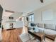 Inviting living room with hardwood floors, a sectional sofa and stylish decor, perfect for entertaining at 4723 Crestone Peak St, Brighton, CO 80601