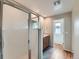Bright main bathroom features a glass-enclosed shower with white tiling and modern fixtures at 4723 Crestone Peak St, Brighton, CO 80601