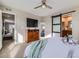 Comfortable main bedroom with sliding barn door to bathroom, dresser and accent wall at 4723 Crestone Peak St, Brighton, CO 80601