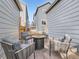 Cozy patio with comfortable seating around a modern fire pit, perfect for outdoor entertaining at 4723 Crestone Peak St, Brighton, CO 80601