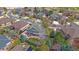 Aerial view of the home showing the manicured lawn, patio, basketball court, and surrounding neighborhood at 13955 Craig Way, Broomfield, CO 80020